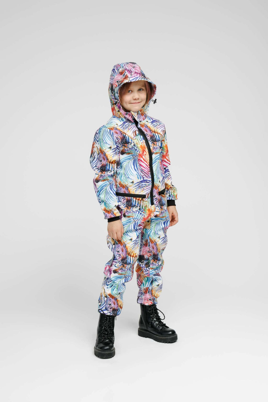 Softshell onesie for kids in rainbow colors, perfect weather-resistant kids onesie for outdoor activities.