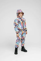 Softshell onesie for kids in rainbow colors, perfect weather-resistant kids onesie for outdoor activities.