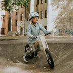 Child riding a leg&go Balance Bike in a skate park, showcasing balance and fun.