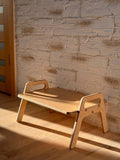 Wooden Kids Floor Table in a well-lit room with textured wall, perfect for toddler activities and Montessori learning.