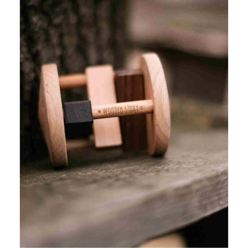 Wooden Rattle - Fieldfare by Wooden Story, a wooden rattle for fine motor skills on a wooden surface.