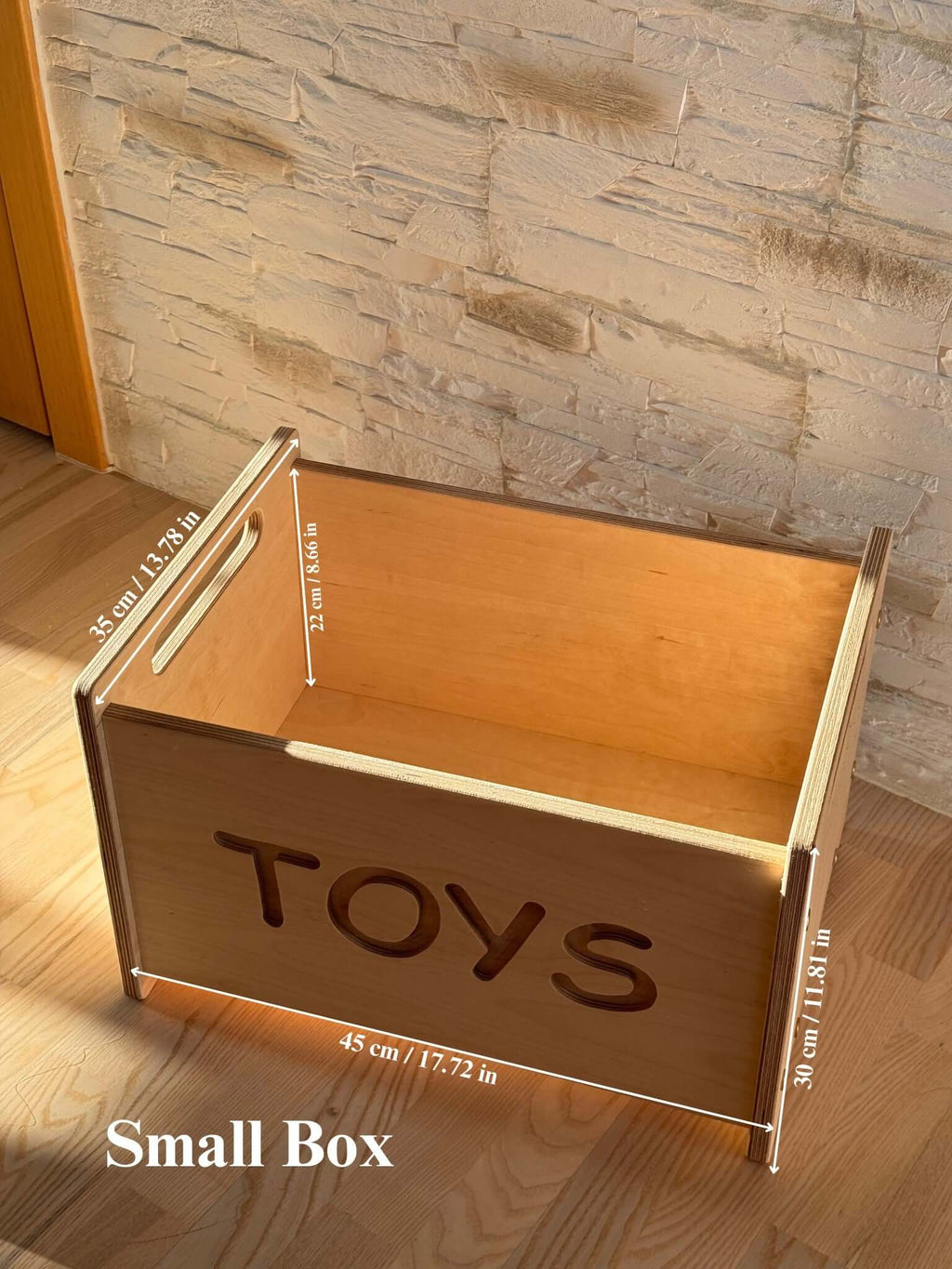 Montessori wooden toy box with open top and engraved 'TOYS', perfect for stylish nursery storage.