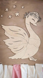 Unique wooden wall decoration featuring a beautiful swan design made from high-quality wooden elements.
