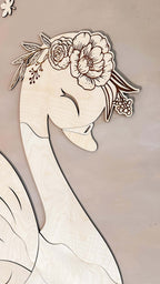 Unique wooden wall decoration featuring a beautifully crafted swan with floral details.