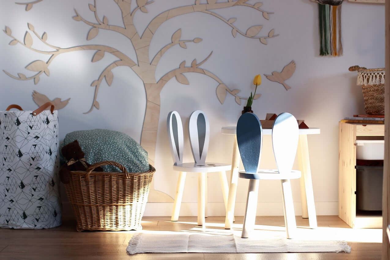 wooden wall decoration tree birds in a cozy room with playful chairs and a natural ambiance
